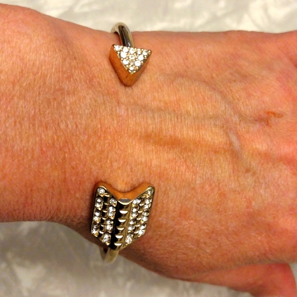 Beautiful faux gold and diamonds wrapped arrow bangle bracelet.